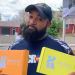 Load image into Gallery viewer, A man is holding two Restore Patch boxes: on his left hand, a Clarity-Focus Patch, and on his right hand, an Energy Patch.